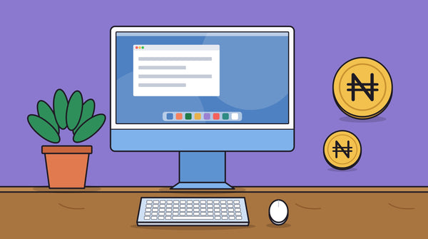 A blue iMac on a desk with a keyboard, a mouse, a plant and naira coins