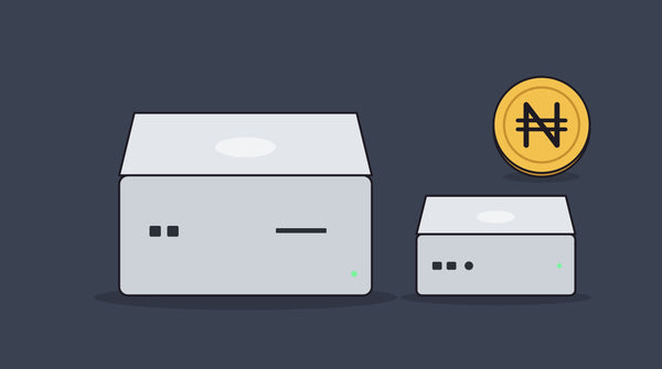 A Mac Studio next to a smaller Mac mini, with a naira coin